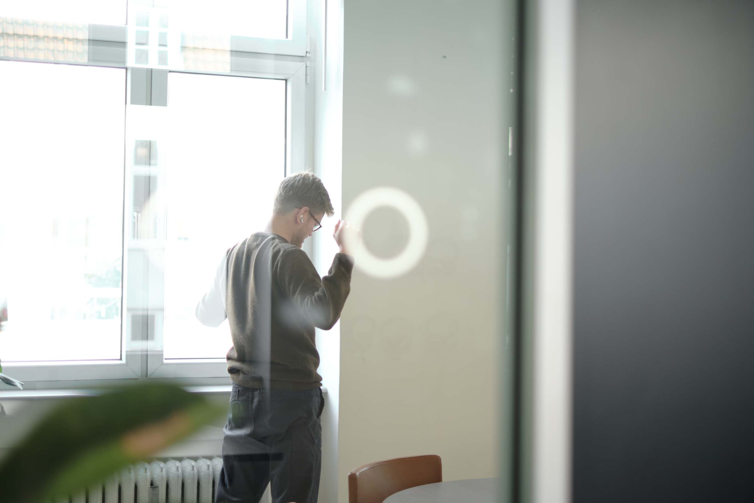 male worker in a meeting room at clerk.io